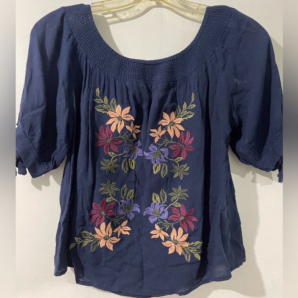 Blue floral shirt.